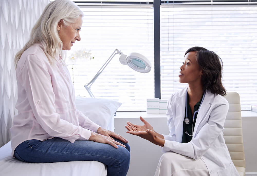 woman discussing vein health with her doctor